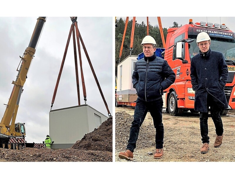 Handeln nicht nur modisch gemeinsam: André Zorger vom Netzbetreiber Bayernwerk (l.) und Bürgermeister Florian Hölzl kurz bevor der Kran hinter ihnen eine Trafostation am Pfeffenhausener Wasserstoffpark auf den vorgesehen Platz hebt. Dahinter entsteht ein Werk zur Wasserstoffproduktion. 